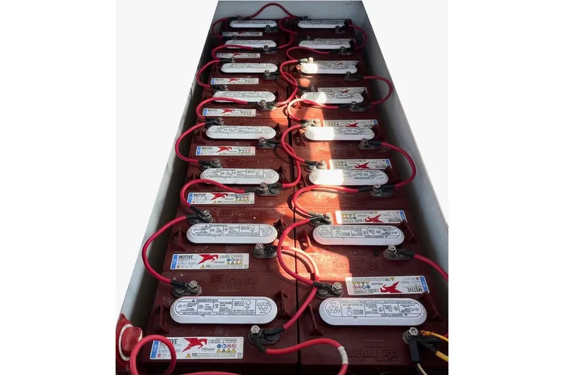 Slide: The Image of Battery compartment of a 2012 Duffy Bay Island 22, featuring multiple connected batteries. - 10