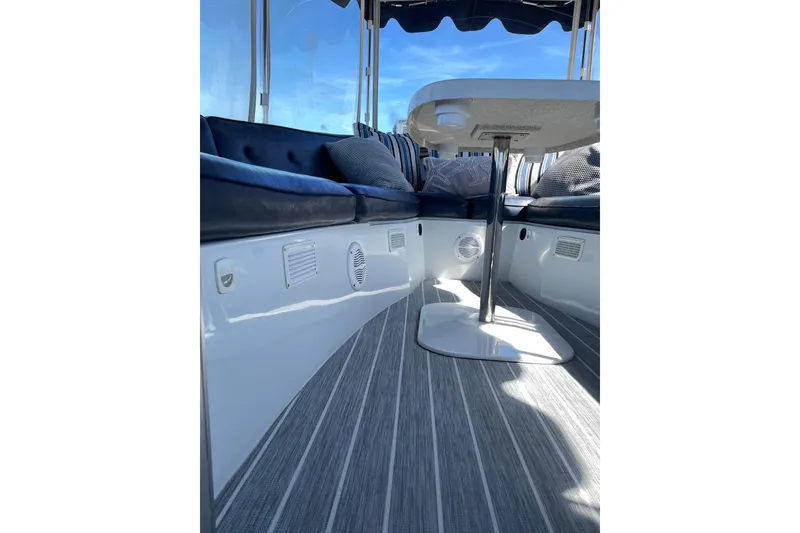 Slide: The Image of Interior of 2012 Duffy Bay Island 22 boat with cushioned seating and table. - 6