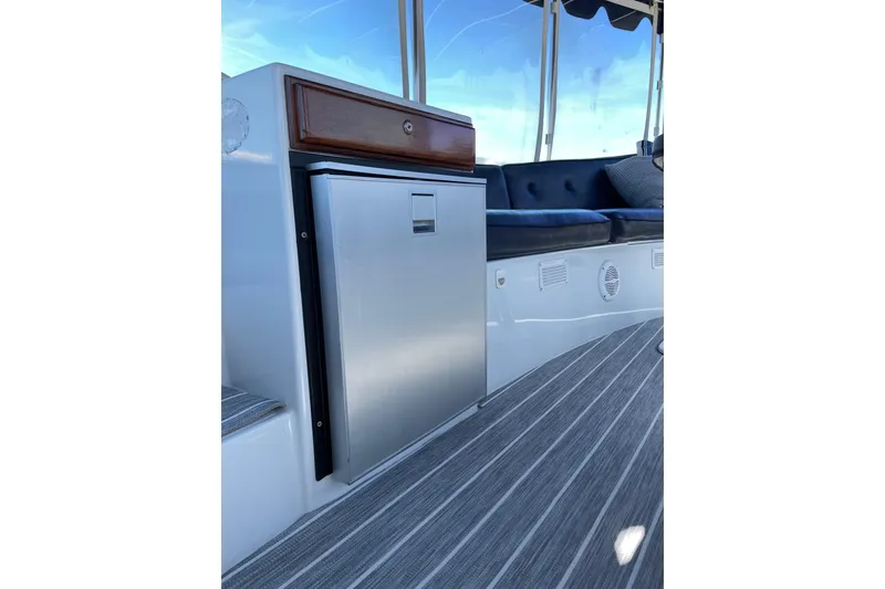 Slide: The Image of Interior of 2012 Duffy Bay Island 22 boat with seating and mini fridge. - 8