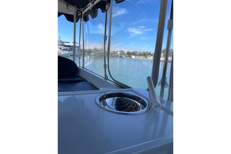 Slide: The Image of Interior view of a 2012 Duffy Bay Island 22 boat with marina backdrop. - 9