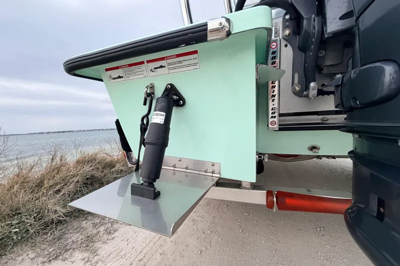 Slide: The Image of 2025 Hell's Bay Professional boat with trim tab, near shoreline. - 21