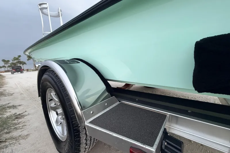 Slide: The Image of 2025 Hell's Bay Professional boat on trailer, showcasing sleek design and sturdy construction. - 23