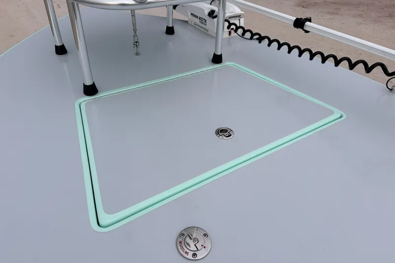 Slide: The Image of 2025 Hell's Bay Professional boat deck with storage hatch and trolling motor. - 32