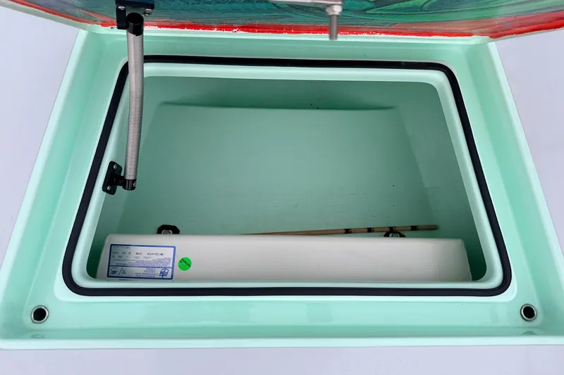 Slide: The Image of Open storage compartment in 2025 Hell's Bay Professional boat, featuring a hydraulic lift. - 35