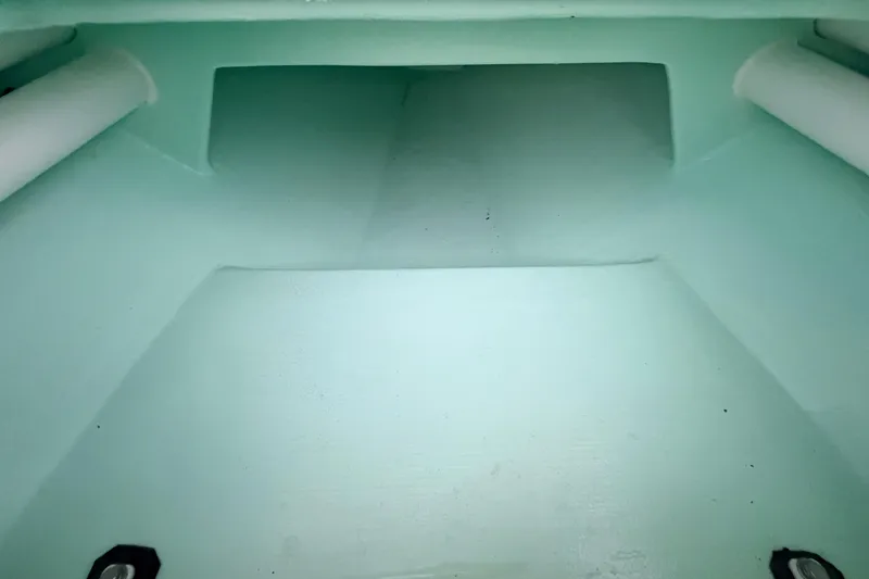 Slide: The Image of Interior view of a 2025 Hell's Bay Professional boat, showcasing storage compartment. - 36