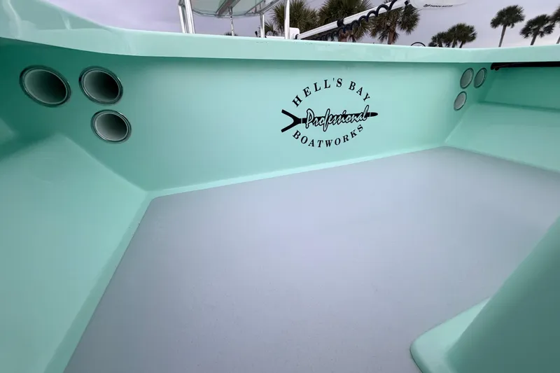 Slide: The Image of 2025 Hell's Bay Professional boat interior with mint green finish and logo. - 38