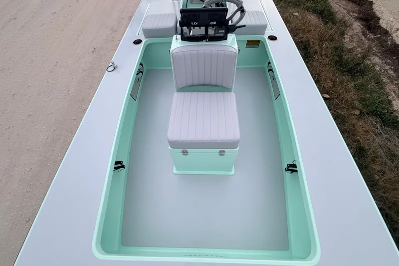 Slide: The Image of 2025 Hell's Bay Professional boat interior with seating and steering console. - 39