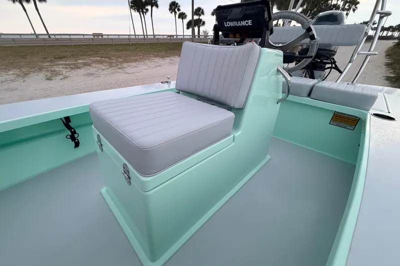 Slide: The Image of 2025 Hell's Bay Professional boat interior with cushioned seating and steering console. - 47