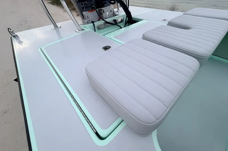 Slide: The Image of 2025 Hell's Bay Professional boat deck with cushioned seating and sleek design. - 63