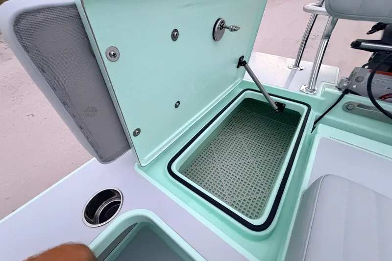 Slide: The Image of Open storage compartment on 2025 Hell's Bay Professional boat, showcasing interior details. - 64