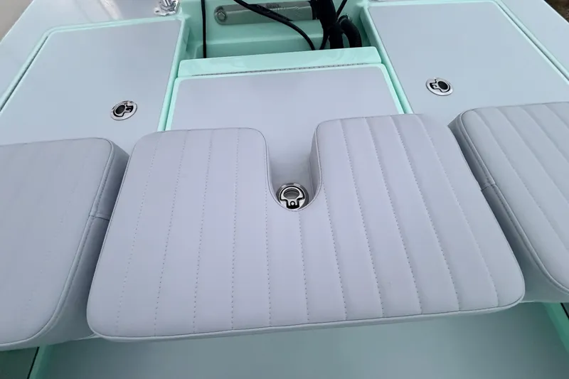 Slide: The Image of 2025 Hell's Bay Professional boat interior with cushioned seating and storage compartments. - 67