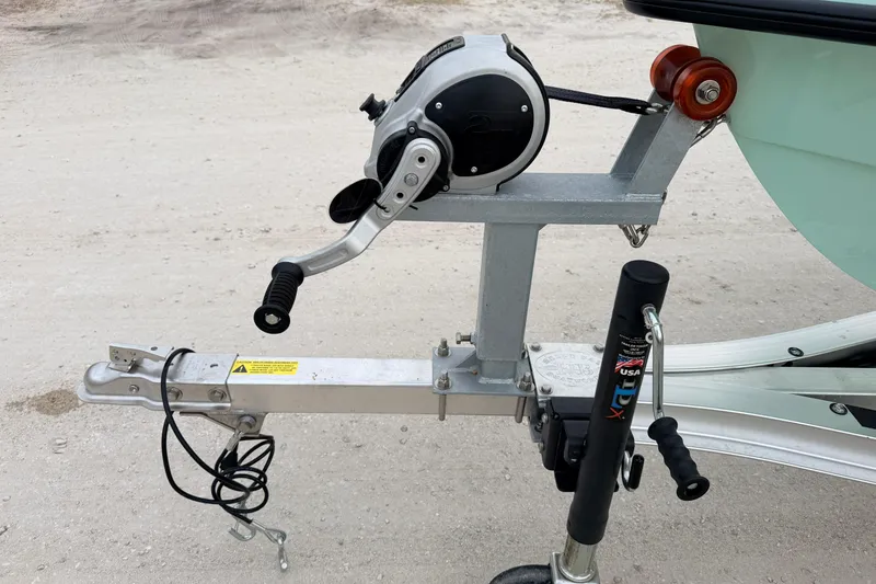 Slide: The Image of Trailer hitch and winch system on a 2025 Hell's Bay Professional boat. - 7