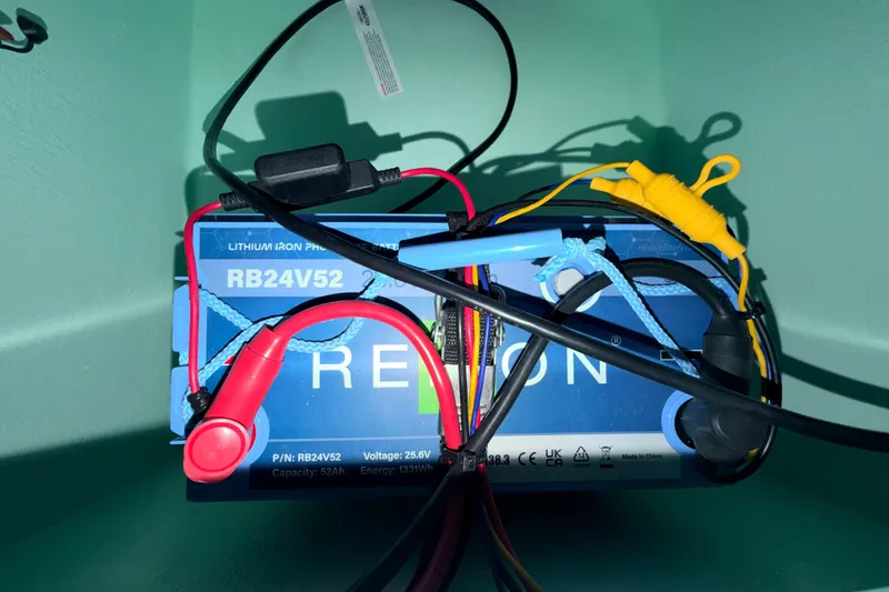 Slide: The Image of Lithium iron phosphate battery in Hell's Bay Professional 2025 boat, model RB24V52. - 70