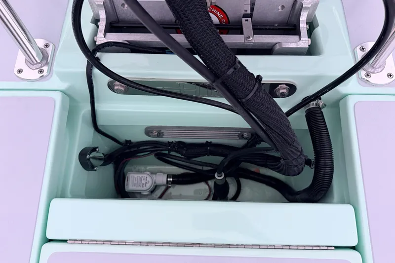 Slide: The Image of Interior view of a 2025 Hell's Bay Professional boat, showcasing wiring and components. - 77