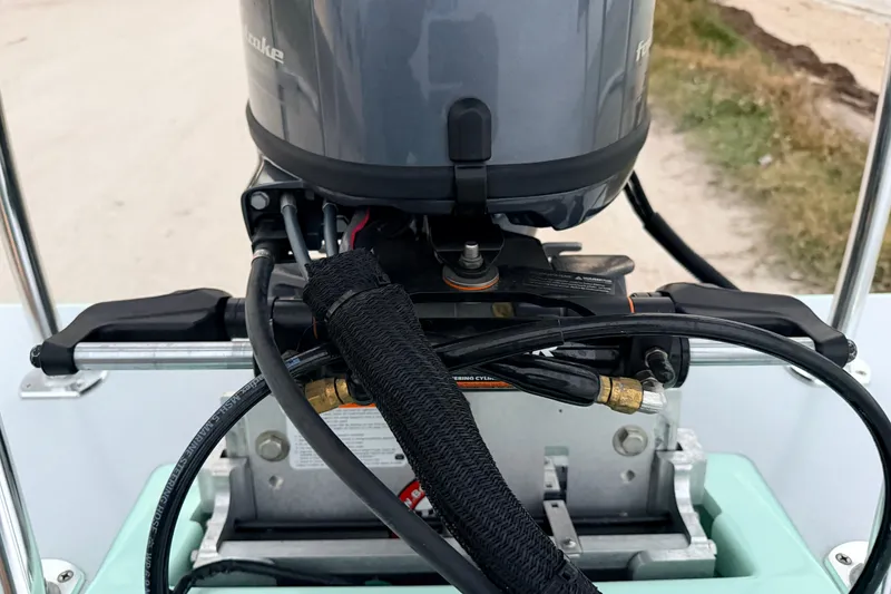 Slide: The Image of 2025 Hell's Bay Professional boat engine close-up, showcasing detailed mechanical components. - 81