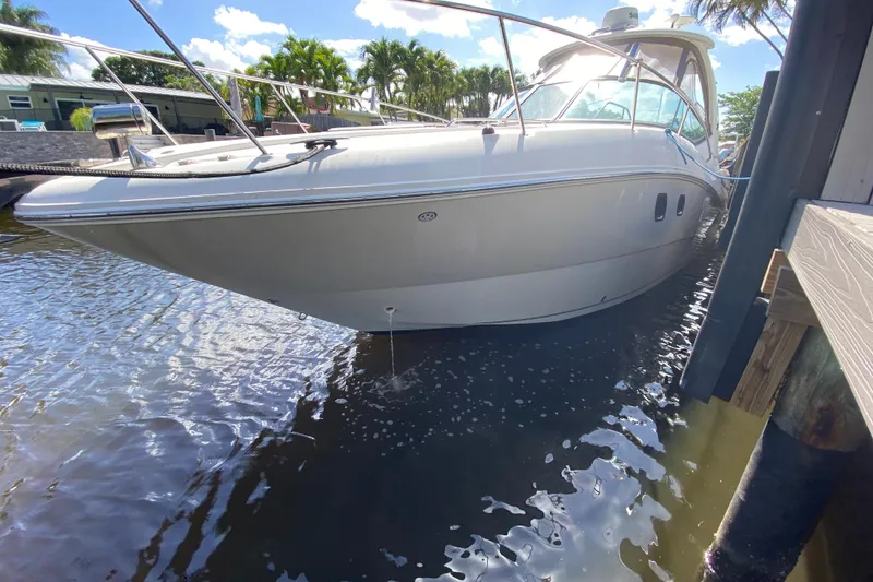 Slide: The Image of 2007 Sea Ray Sundancer 310 docked in sunny marina setting. - 10