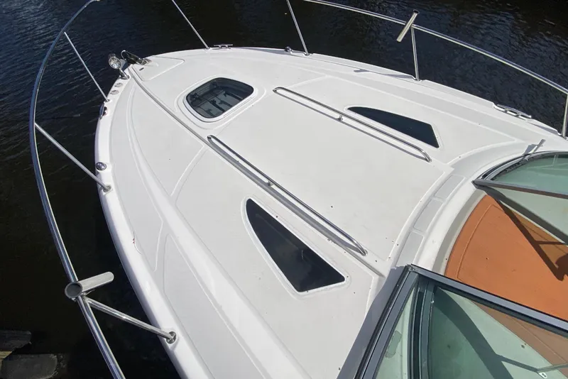 Slide: The Image of Top view of a 2007 Sea Ray Sundancer 310 boat's bow with sleek design. - 23