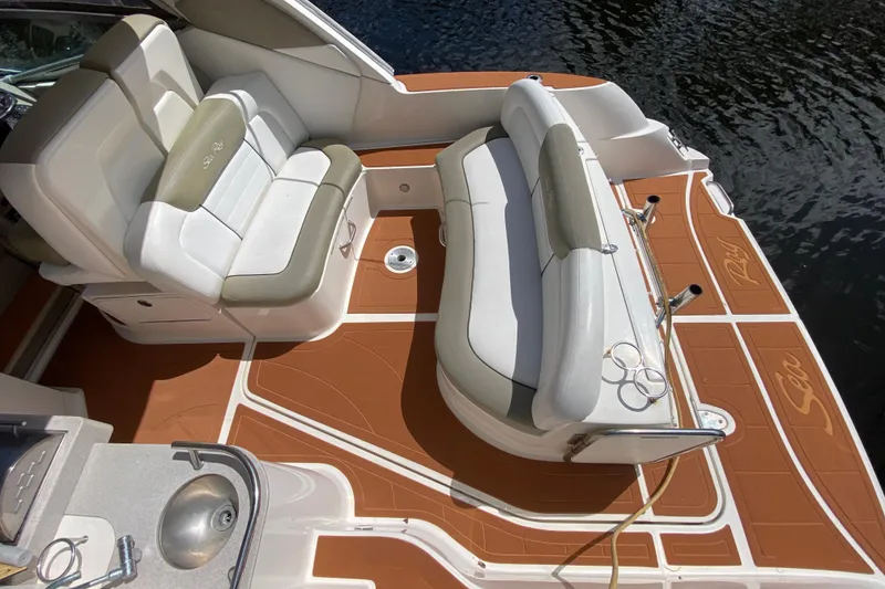 Slide: The Image of 2007 Sea Ray Sundancer 310 boat deck with seating and sink, overlooking water. - 26