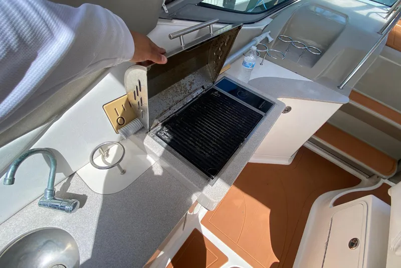 Slide: The Image of 2007 Sea Ray Sundancer 310 boat interior with kitchenette and sink. - 30