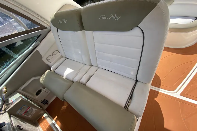 Slide: The Image of 2007 Sea Ray Sundancer 310 interior seating with white and beige upholstery. - 31