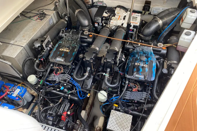 Slide: The Image of Engine compartment of a 2007 Sea Ray Sundancer 310, showcasing twin MerCruiser engines. - 48