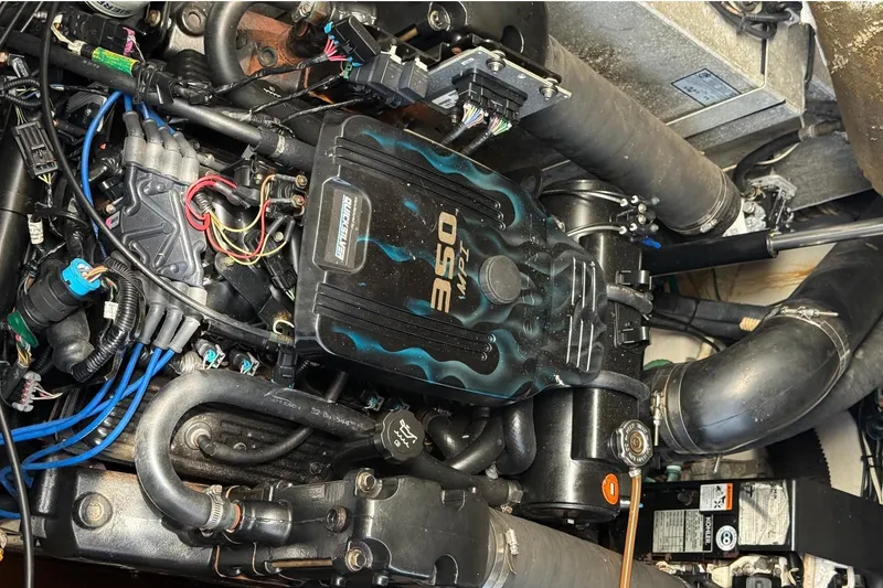 Slide: The Image of Engine compartment of a 2007 Sea Ray Sundancer 310 boat, showcasing detailed components. - 49