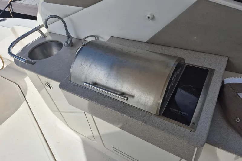 Slide: The Image of Outdoor kitchenette on 2007 Sea Ray Sundancer 310 yacht with sink and grill. - 52