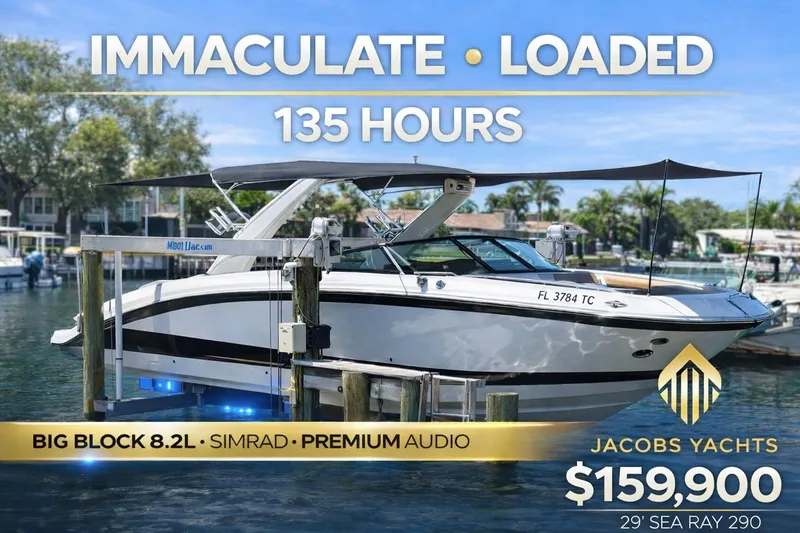 The Image of 2022 Sea Ray SDX 290 boat docked on a lift in a sunny marina. - 0