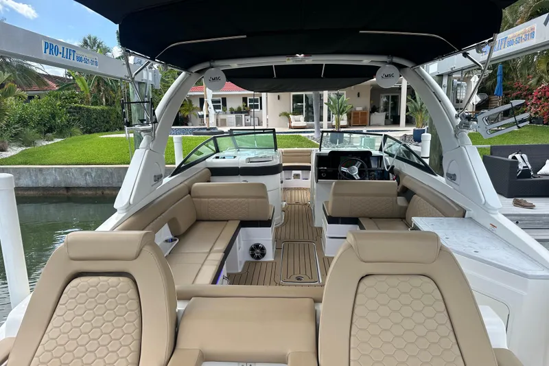 Slide: The Image of 2022 Sea Ray SDX 290 boat interior with luxurious seating and modern design. - 2