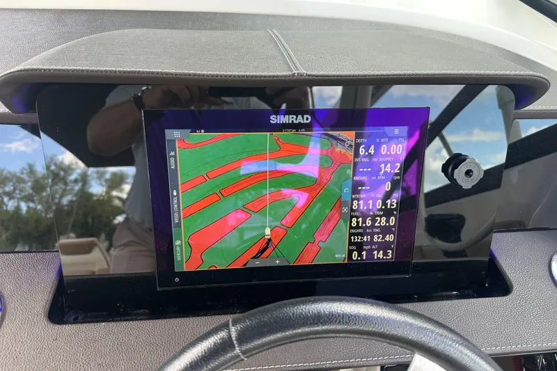 Slide: The Image of Simrad navigation display on 2022 Sea Ray SDX 290 boat dashboard. - 3