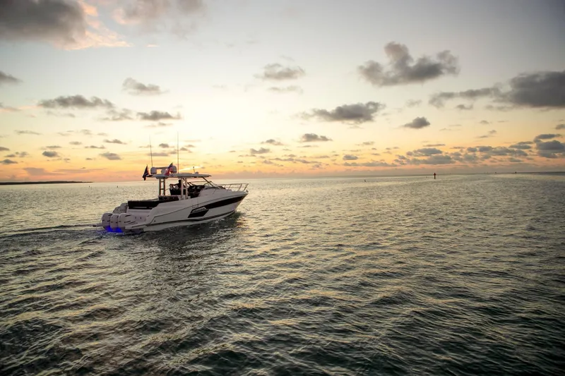 Slide: The Image of Jeanneau Leader 12.5 2024 cruising at sunset on the sea. - 10