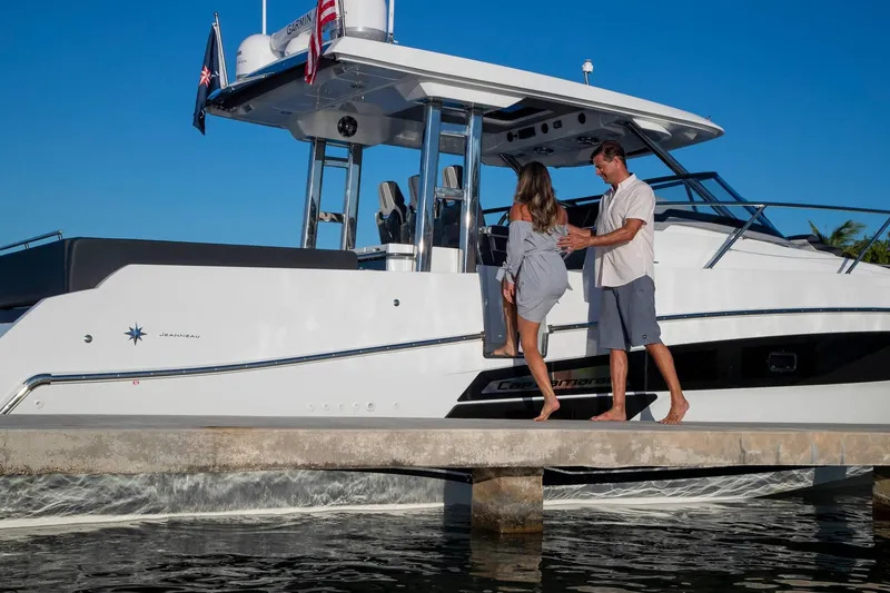 Slide: The Image of Couple boarding 2024 Jeanneau Leader 12.5 yacht at dock. - 7