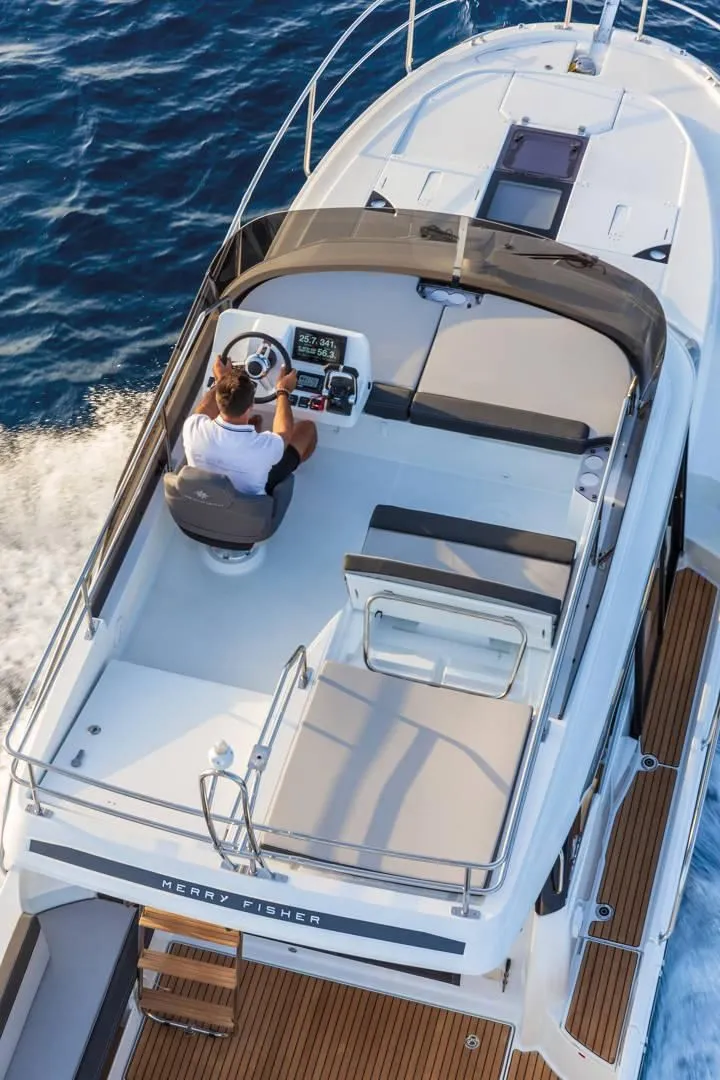 Slide: The Image of Jeanneau NC 1095 Fly 2026 on open sea, upper helm station. - 6