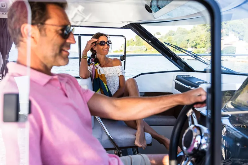 Slide: The Image of Couple enjoying boat ride on Jeanneau NC 795 Series 2, 2025 model. - 15