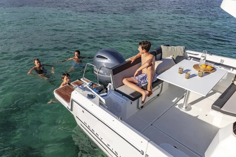 Slide: The Image of Jeanneau NC 795 Series 2 boat with people swimming, 2025 model. - 26