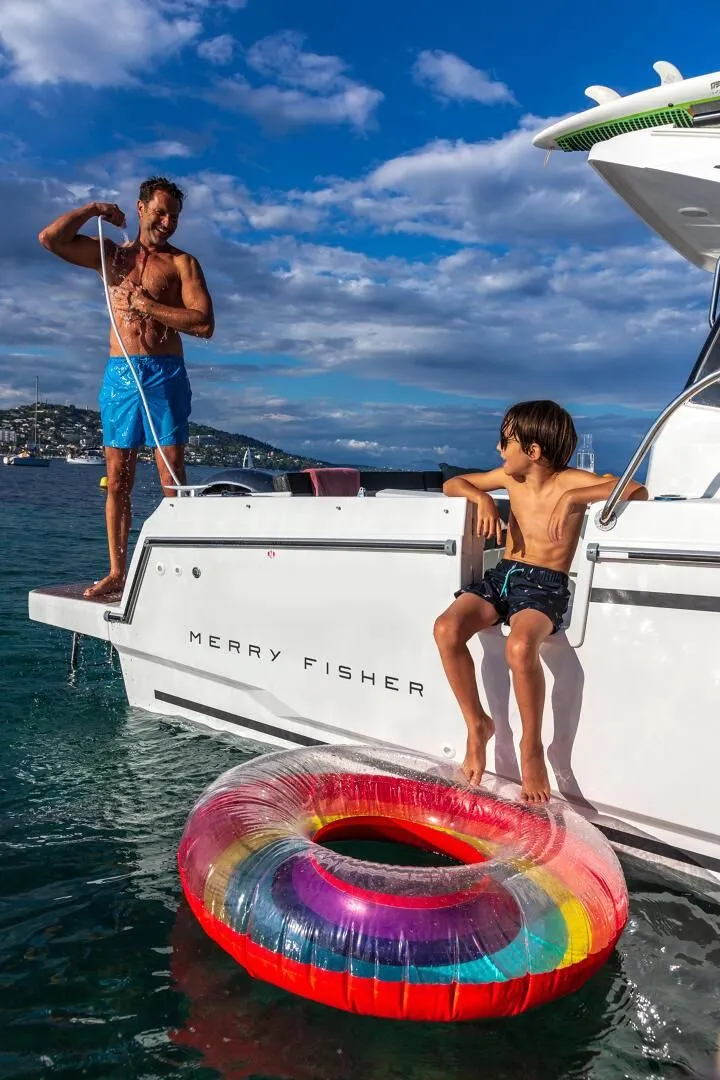 Slide: The Image of Family enjoying Jeanneau NC 795 Series 2 boat outing in 2025. - 8