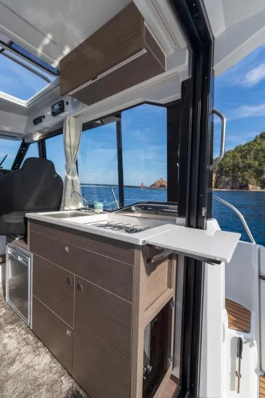 Slide: The Image of Interior of Jeanneau NC 895 S2 yacht, modern kitchen, sea view. - 15