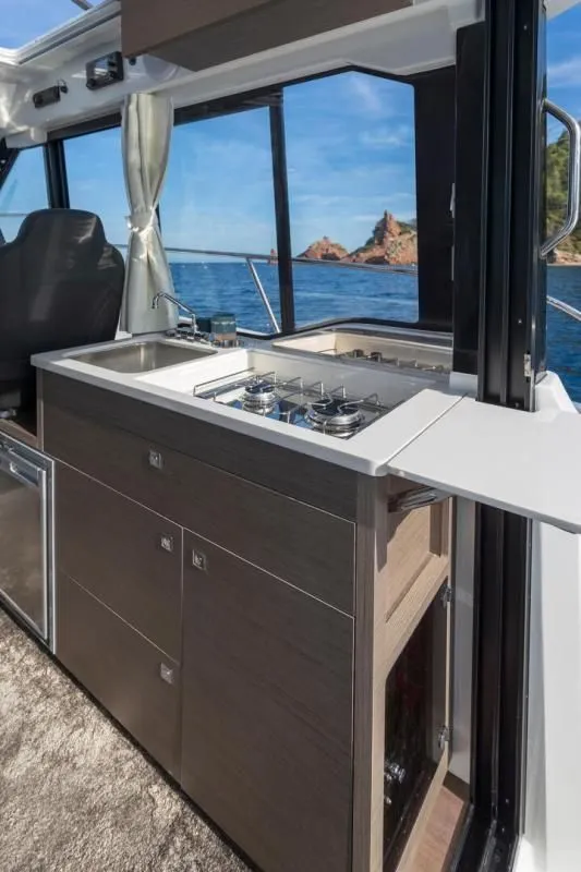 Slide: The Image of Interior of Jeanneau NC 895 S2 yacht featuring modern kitchen, 2026 model. - 17