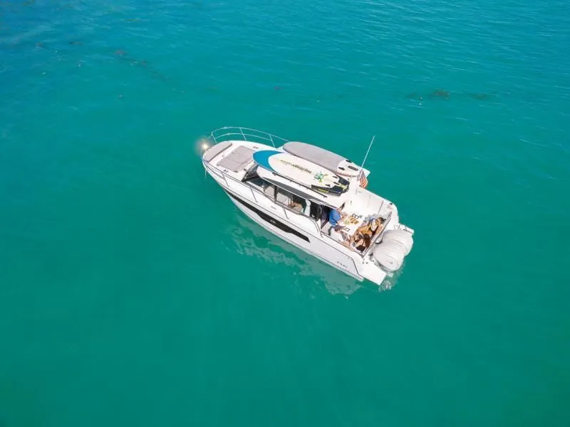 Slide: The Image of Jeanneau NC 895 S2 2026 on clear turquoise water. - 4