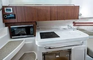 Slide: The Image of Interior of Grady-White Marlin 300 yacht kitchen, year 2026. - 14