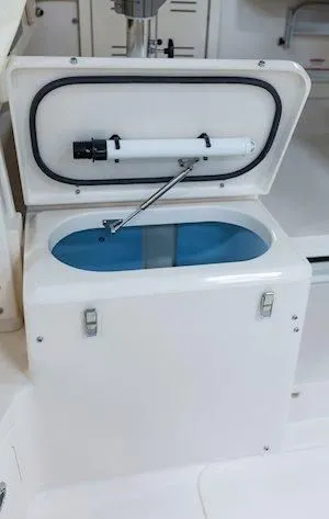 Slide: The Image of Grady-White Marlin 300 2026, open storage compartment with blue interior lining. - 20