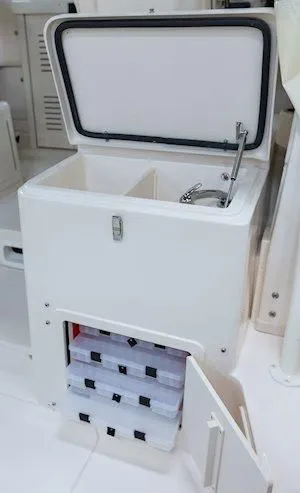 Slide: The Image of Grady-White Marlin 300 2026 boat kitchenette with storage. - 21