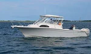 Slide: The Image of 2026 Grady-White Marlin 300 boat on open water. - 4