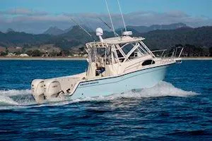 Slide: The Image of 2026 Grady-White Marlin 300 boat cruising on water. - 6