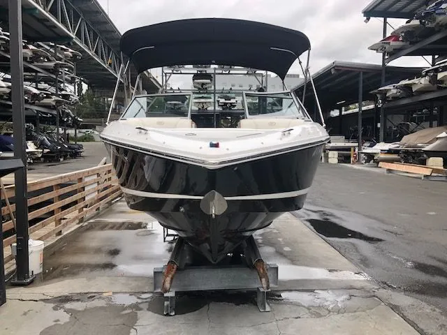 Slide: The Image of 2014 Cobalt 210 boat stored in a marina. - 11