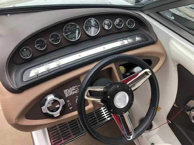 Slide: The Image of Dashboard of a 2014 Cobalt 210 boat with wood trim. - 3