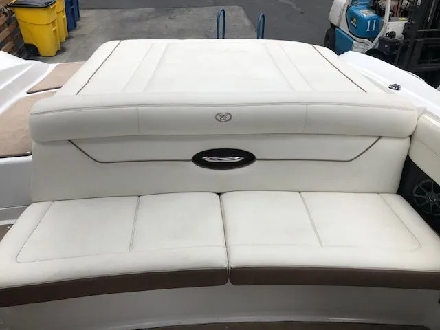 Slide: The Image of Rear view of a 2014 Cobalt 210 boat with white upholstered seating. - 5