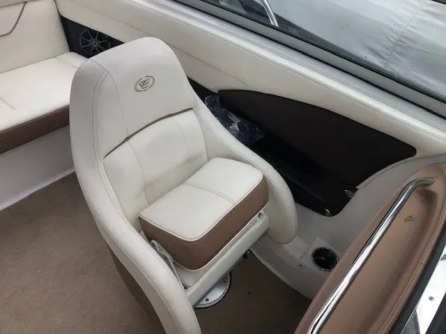Slide: The Image of Interior of a 2014 Cobalt 210 boat with beige seating. - 6