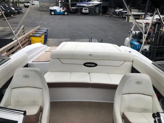 Slide: The Image of Interior of a 2014 Cobalt 210 boat with white seating. - 7