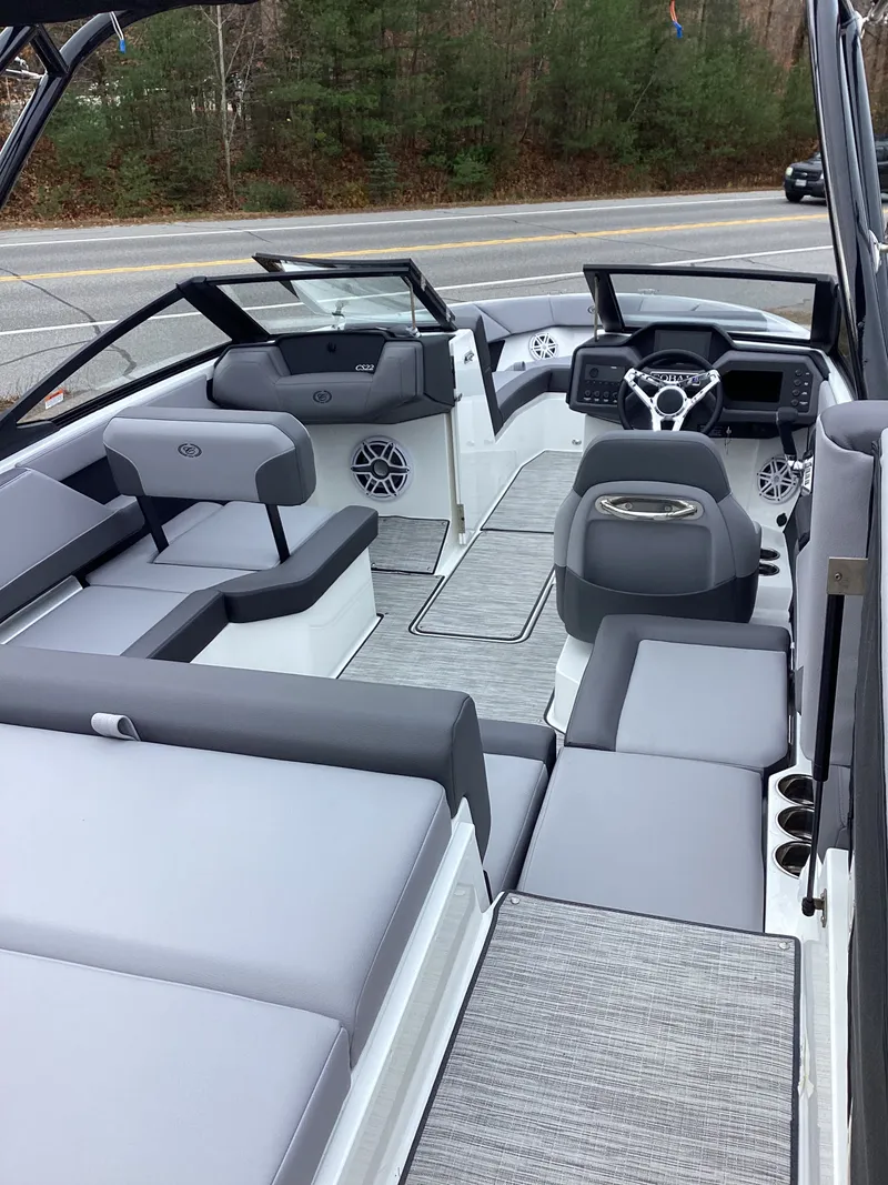 Slide: The Image of Interior of a 2026 Cobalt CS22 boat with gray upholstery. - 6